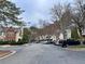Neighborhood street featuring charming townhomes with well-maintained landscaping and mature trees at 3015 Camden Way, Alpharetta, GA 30005
