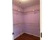 An organized walk-in closet with shelving, optimizing space and accessibility at 3015 Camden Way, Alpharetta, GA 30005