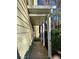 Covered walkway showing the side of the home with natural surroundings at 3015 Camden Way, Alpharetta, GA 30005