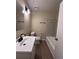 Bathroom with updated vanity, sink, and bathtub at 4829 Woodhurst Way, Stone Mountain, GA 30088