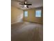 Bright bedroom featuring two windows for natural light and neutral carpet at 4829 Woodhurst Way, Stone Mountain, GA 30088