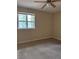Cozy bedroom with neutral carpet and a window at 4829 Woodhurst Way, Stone Mountain, GA 30088