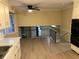 Bright kitchen with white cabinets, an oven, and view to the living room at 4829 Woodhurst Way, Stone Mountain, GA 30088
