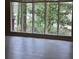 Bright living room with large windows providing lots of natural light at 4829 Woodhurst Way, Stone Mountain, GA 30088