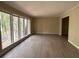 Bright living room featuring a large bay window and neutral wall color at 4829 Woodhurst Way, Stone Mountain, GA 30088