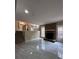 Living room featuring a fireplace, tile floors, and access to the kitchen at 4829 Woodhurst Way, Stone Mountain, GA 30088