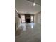Spacious living room with stone fireplace and large windows offering natural light at 4829 Woodhurst Way, Stone Mountain, GA 30088