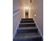 Carpeted stairway leading to the upper level of the home at 4829 Woodhurst Way, Stone Mountain, GA 30088