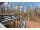 Multi-level deck overlooking a wooded backyard at 2590 Runic Way, Johns Creek, GA 30022