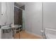 Stylish bathroom with a unique sink, mosaic tiled shower, and modern toilet at 2590 Runic Way, Johns Creek, GA 30022