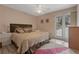 Cozy bedroom featuring a plush bed, natural light, and peaceful ambiance at 2590 Runic Way, Johns Creek, GA 30022