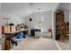 Spacious bonus room featuring a large storage table and built-in shelving at 2590 Runic Way, Johns Creek, GA 30022