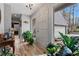 Inviting entryway with hardwood floors, plants, and a view of the garage at 2590 Runic Way, Johns Creek, GA 30022