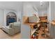 Compact kitchenette with open shelving, bar stools, and modern appliances at 2590 Runic Way, Johns Creek, GA 30022
