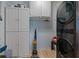 Well-organized laundry room with storage cabinets and a modern washer and dryer at 2590 Runic Way, Johns Creek, GA 30022
