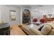 Open-concept living area features built-in shelving and a comfortable sectional sofa at 2590 Runic Way, Johns Creek, GA 30022