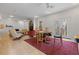 Open-concept living room and dining area, with tiled floor and neutral walls at 2590 Runic Way, Johns Creek, GA 30022