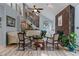 Spacious living room with vaulted ceilings, a fireplace, and large windows providing natural light at 2590 Runic Way, Johns Creek, GA 30022