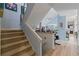 Carpeted staircase with railing leading to the upper level at 2590 Runic Way, Johns Creek, GA 30022