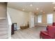 Open basement featuring wood-look flooring, natural light, and stairs leading to the upper level at 1231 Wildcliff Cir, Atlanta, GA 30329
