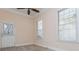 Bright bedroom with a ceiling fan, two windows, and a door leading to the outside at 1231 Wildcliff Cir, Atlanta, GA 30329
