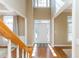 Inviting home foyer with hardwood floors, staircase, and a bright entryway at 1231 Wildcliff Cir, Atlanta, GA 30329