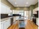 Spacious kitchen featuring granite countertops, stainless steel appliances, and hardwood floors at 1231 Wildcliff Cir, Atlanta, GA 30329