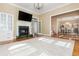 Spacious living room featuring a fireplace, hardwood floors, and an elegant chandelier at 1231 Wildcliff Cir, Atlanta, GA 30329