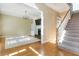 Spacious living area with hardwood floors, a fireplace, and staircase view at 1231 Wildcliff Cir, Atlanta, GA 30329