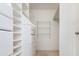 Walk-in closet with custom shelving, drawers, and hanging rods for optimal storage and organization at 1231 Wildcliff Cir, Atlanta, GA 30329