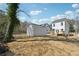Large backyard with a detached garage, wooden deck attached to the house, and lots of potential at 240 Mount Zion Rd, Hapeville, GA 30354