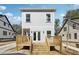 The backyard has a wood deck with stairs to the ground and an attached home with grey siding at 240 Mount Zion Rd, Hapeville, GA 30354