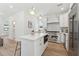 Bright kitchen features a large island, stainless steel appliances, and modern white cabinetry at 240 Mount Zion Rd, Hapeville, GA 30354