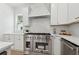 Modern kitchen with stainless steel appliances, white cabinetry, and elegant countertops at 240 Mount Zion Rd, Hapeville, GA 30354
