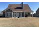 Home featuring back patio with white pergola and a well-manicured lawn at 3817 Bay Orchard Ln, Loganville, GA 30052
