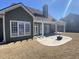 View of concrete backyard patio area with pergola, outdoor fireplace, and covered porch at 3817 Bay Orchard Ln, Loganville, GA 30052