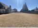 Large backyard with a combination of fenced and open space at 3817 Bay Orchard Ln, Loganville, GA 30052