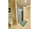 Bathroom featuring tile floors, toilet, shower and linen closet at 3817 Bay Orchard Ln, Loganville, GA 30052