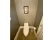 This powder room offers a minimalist design and space-saving toilet at 3817 Bay Orchard Ln, Loganville, GA 30052