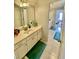 Bathroom featuring double sinks, tile floor and view to a bedroom at 3817 Bay Orchard Ln, Loganville, GA 30052
