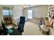 Bedroom with a daybed, computer desk, and built-in shelving at 3817 Bay Orchard Ln, Loganville, GA 30052