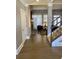 View of foyer and formal living room with a brick fireplace and staircase at 3817 Bay Orchard Ln, Loganville, GA 30052