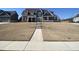 Charming two-story home with a mix of brick and siding, complemented by a well-manicured lawn at 3817 Bay Orchard Ln, Loganville, GA 30052
