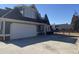 Spacious garage and driveway with neutral siding and brick accents at 3817 Bay Orchard Ln, Loganville, GA 30052