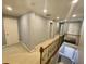 Upstairs hallway with carpet, white doors, baseboards and trim at 3817 Bay Orchard Ln, Loganville, GA 30052