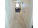 Bright tiled hallway connecting to the main living areas of the house at 3817 Bay Orchard Ln, Loganville, GA 30052
