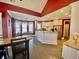 Eat-in kitchen with stainless steel appliances, island with granite countertops, and hardwood floors at 3817 Bay Orchard Ln, Loganville, GA 30052