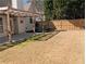 Backyard featuring a covered patio, wooden fence and green grass at 510 Pittman Mill Ct, Loganville, GA 30052