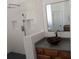 Bathroom featuring a vessel sink and a modern shower at 510 Pittman Mill Ct, Loganville, GA 30052