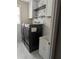 Laundry room featuring modern appliances, a sink, and decorative wallpaper at 510 Pittman Mill Ct, Loganville, GA 30052